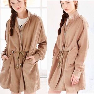 Unif x Urban Outfitters beige trench jacket.